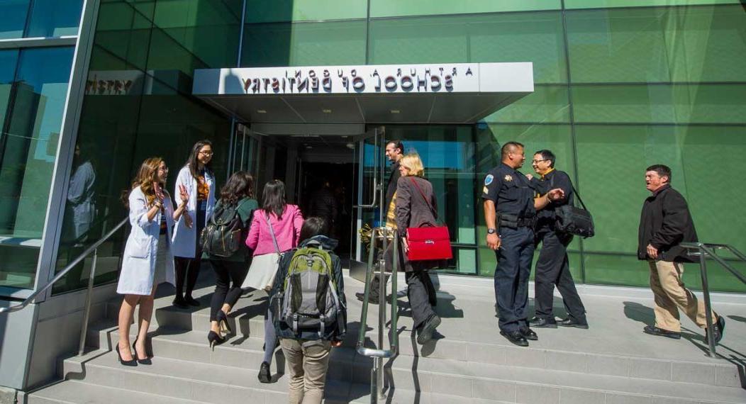 students, staff and faculty at entrance to San Francisco campus
